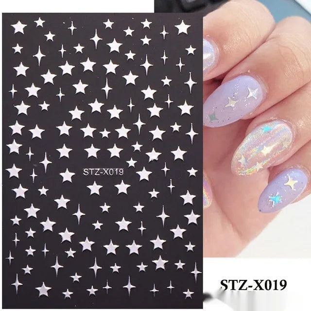 Sheet of black and silver strip nail art stickers with cartoon and love heart designs
