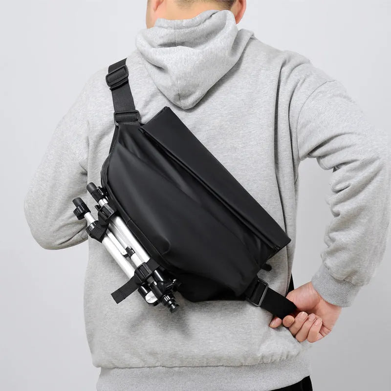 Grey medium-sized PU leather crossbody sling bag for men with a horizontal square shape.