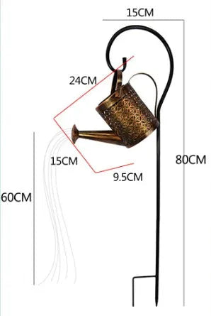 Enchanted watering can solar lamp with warm white star-shaped LED lights in a garden setting