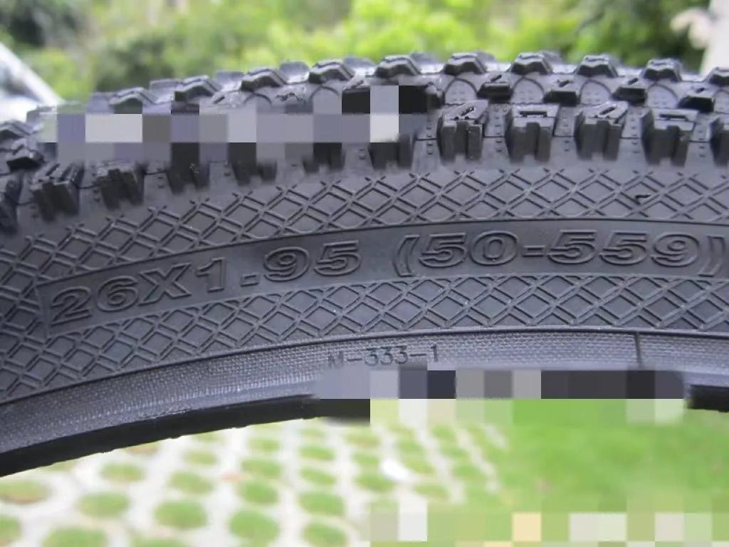 Ultralight puncture-resistant mountain bike tyre showing tread pattern and available sizes