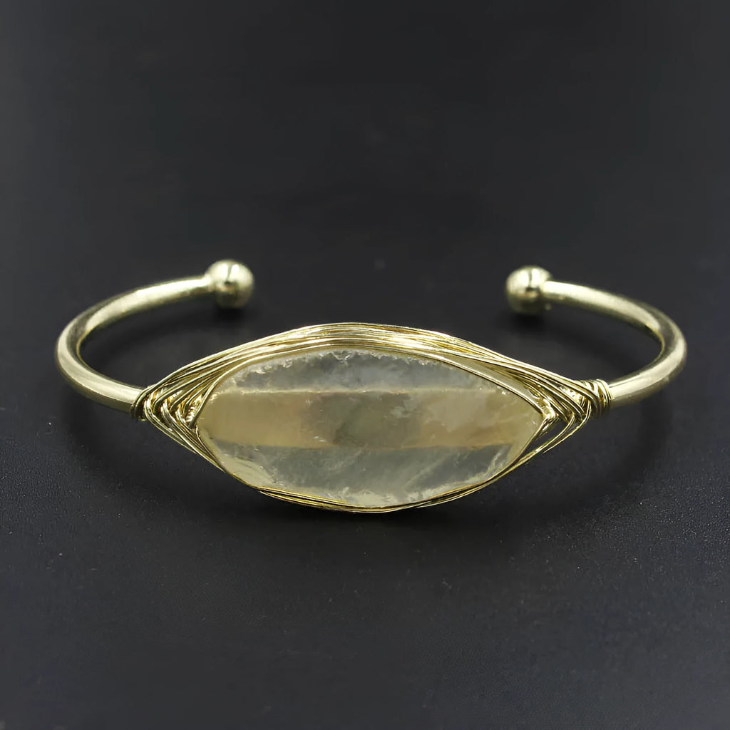 Natural raw gemstone crystal bracelet in ethnic style with simple opening, shown in one of nine colour options.