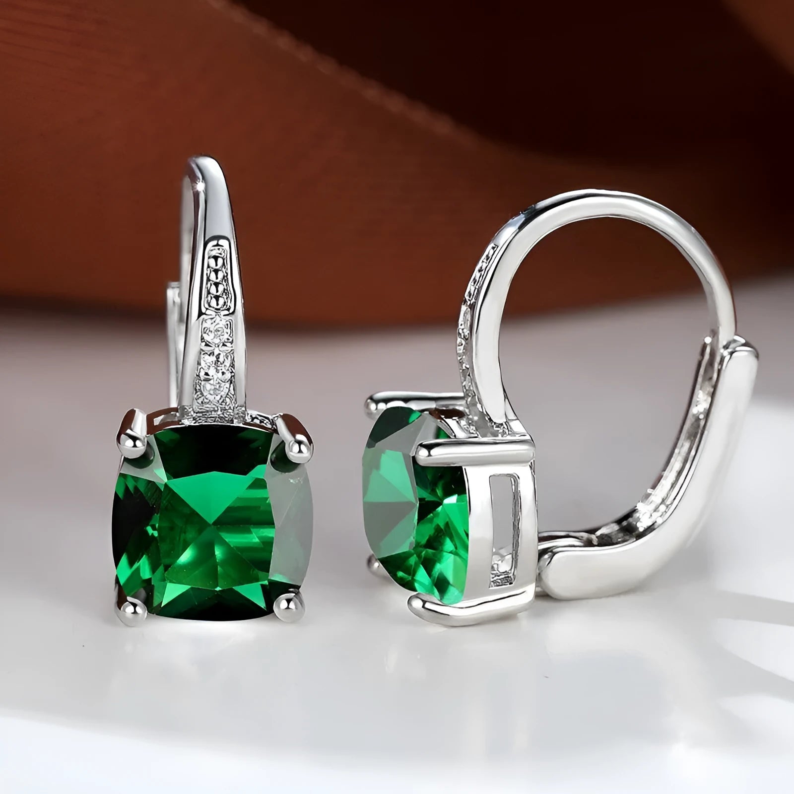Square geometric ear hook studs with a round zircon stone, shown in a gold electroplated finish.