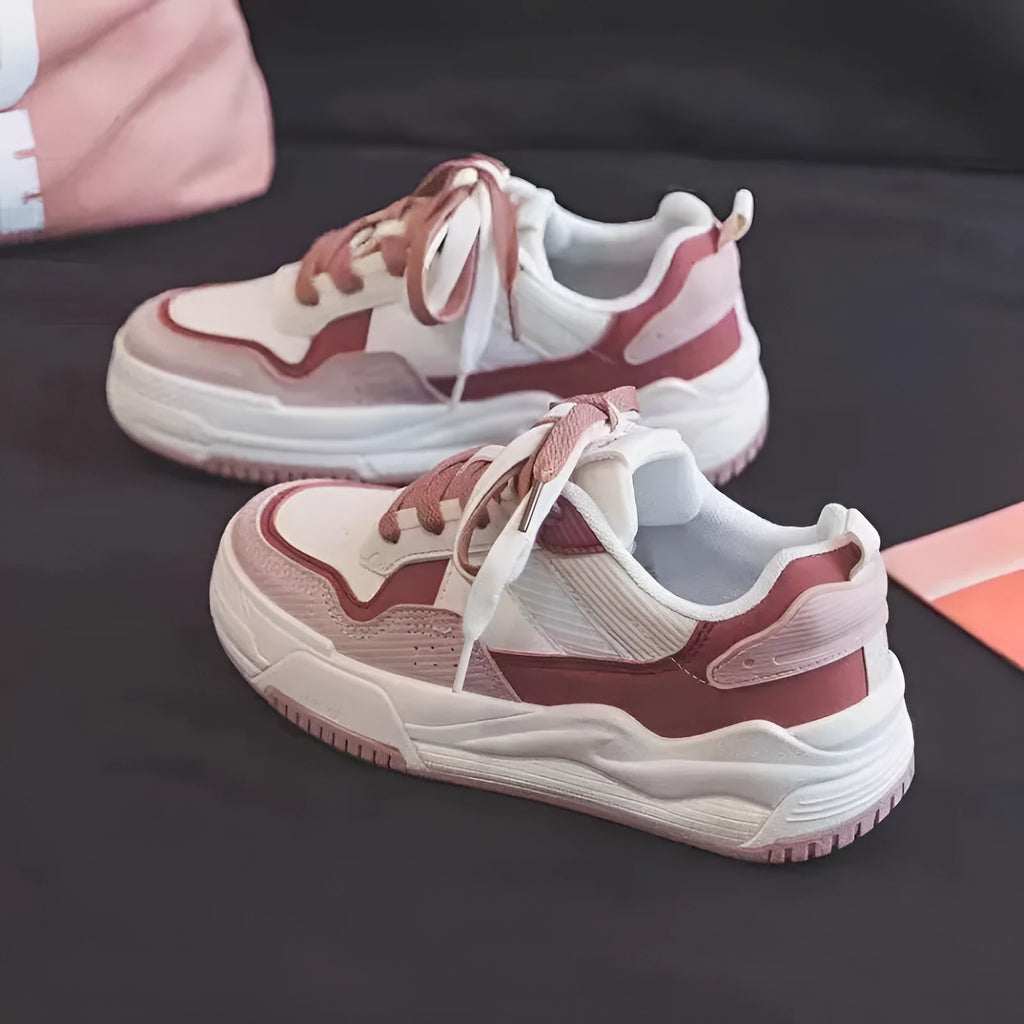 Pink and beige low-top sneakers with rubber soles and height-increasing design