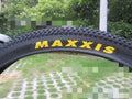 Ultralight puncture-resistant mountain bike tyre showing tread pattern and available sizes