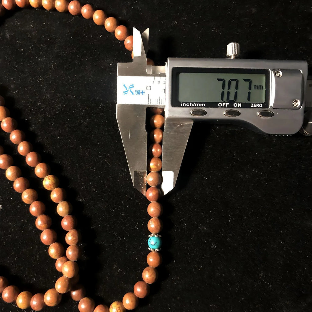 Stone bracelet with 108 hand-polished geometric beads measuring 5-6mm diameter