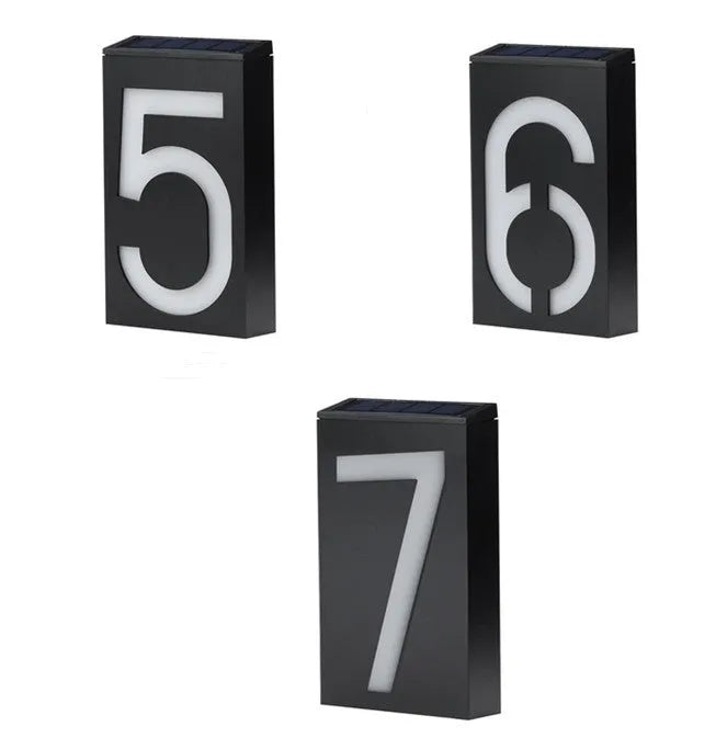 Solar powered outdoor house number light with LED illumination and concealed mounting design