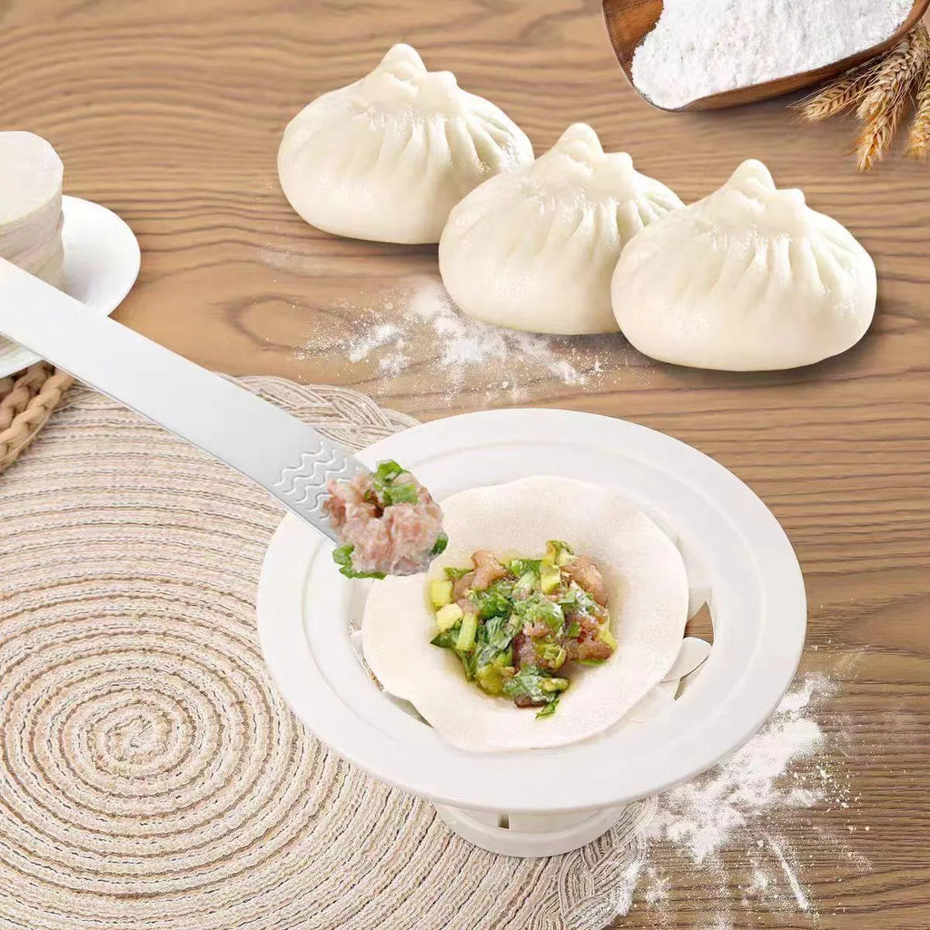 Four black plastic Jinkali steamed bun moulds for shaping baozi.