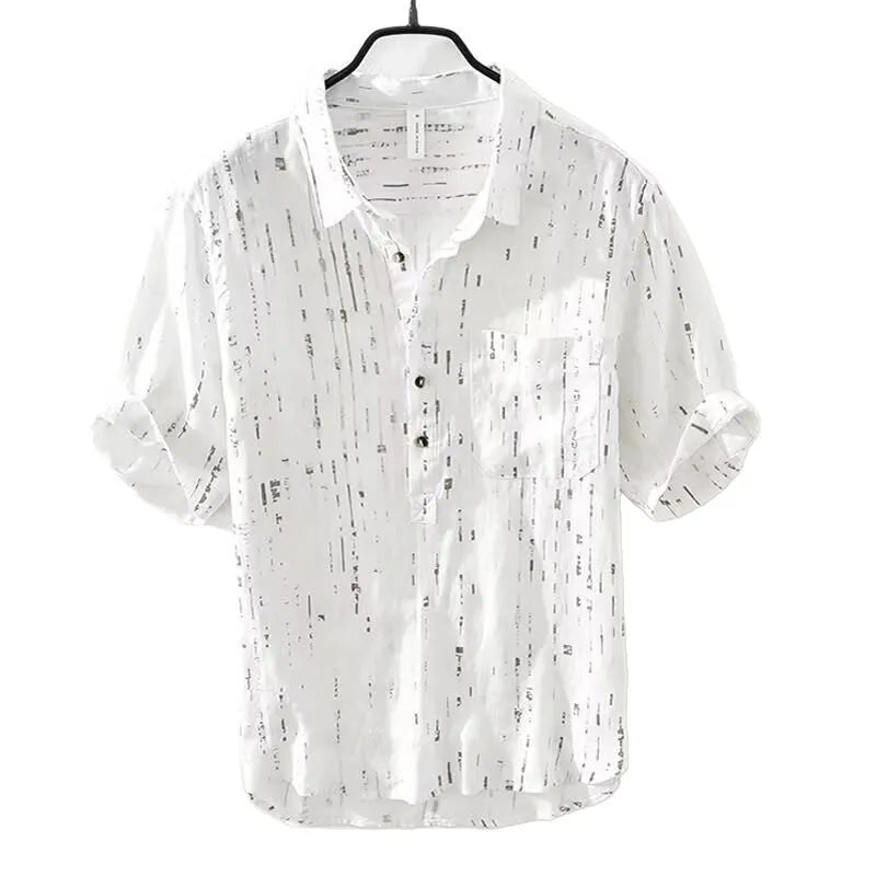 A man's loose-fit short-sleeved polo shirt in black, showing the lapel collar and casual cardigan style.