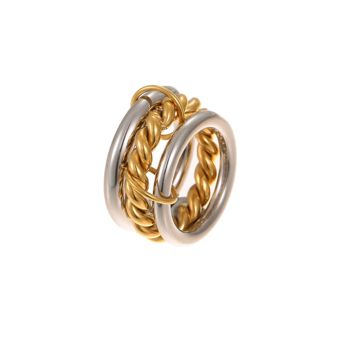 Stacked gold plated stainless steel rings showing layered jewellery look on female hand