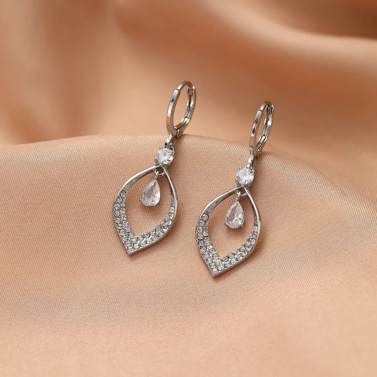 Copper water drop tassel earrings with a zircon stone and gold or silver ear buckles.