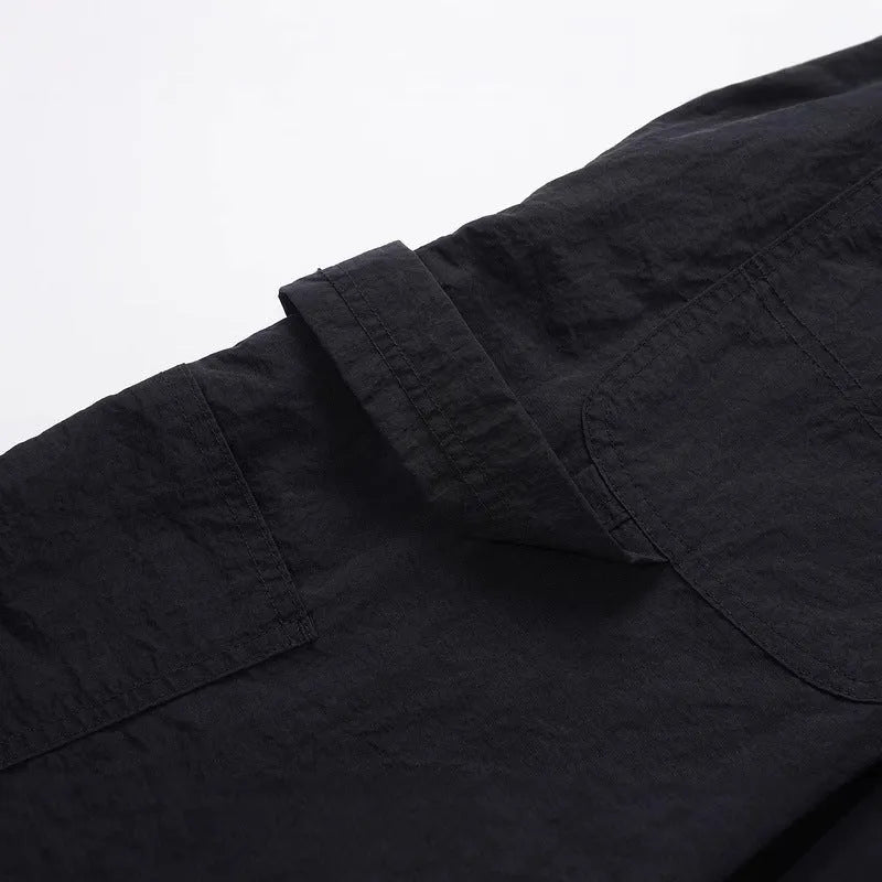 Black paratrooper trousers with elastic waistband and three-dimensional cutting in baggy fit style