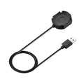 Black Withings Hybrid Smart Watch charging cable with magnetic probe on a desk
