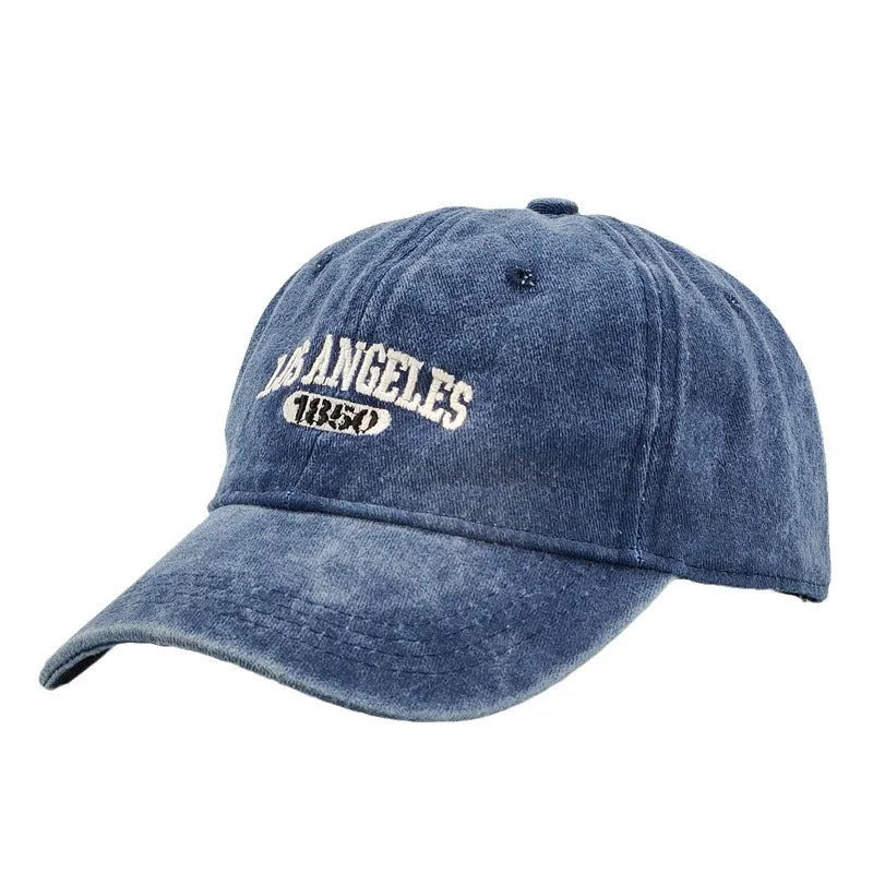 Retro-style personalised baseball cap with distressed letter embroidery on an adjustable strap, shown in beige colour.
