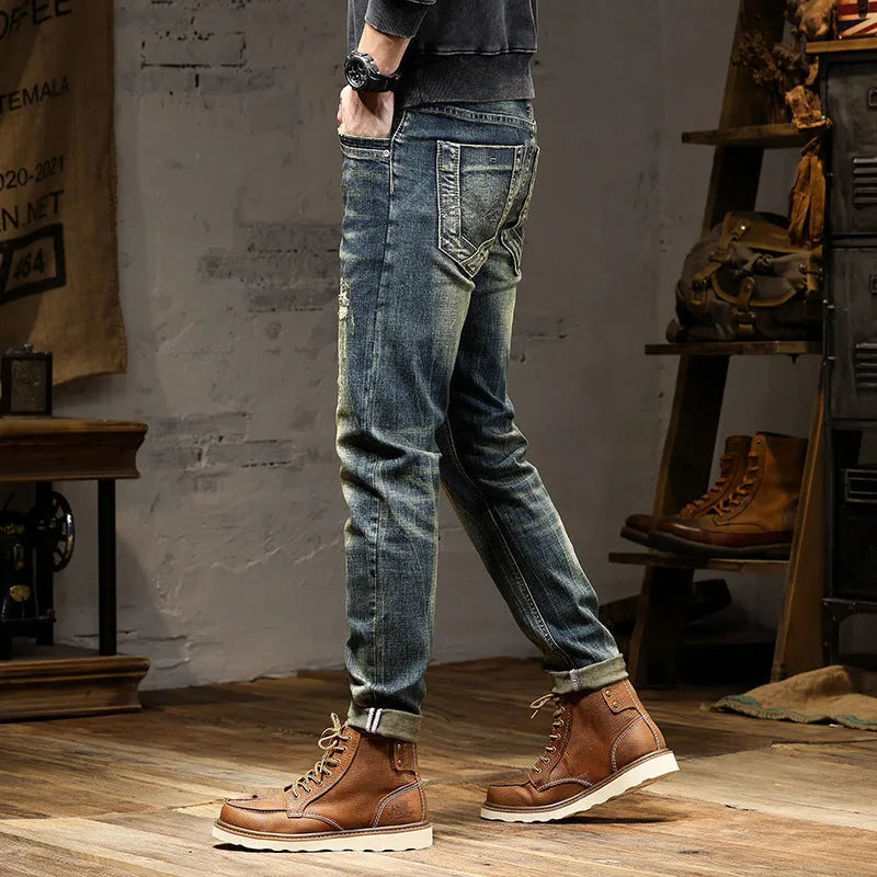 Men's skinny-fit jeans in a retro blue colour with a zip fly, shown laid flat.