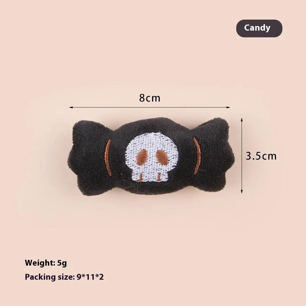 Plush cat teaser toy with three interchangeable heads: eyes, candy, and skull designs