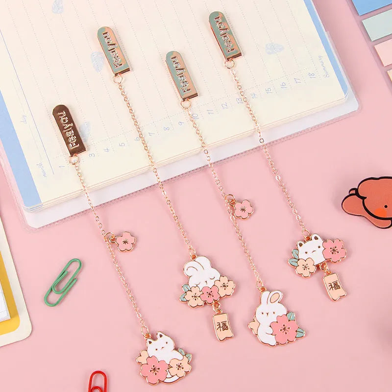 Creative cartoon metal pendant bookmark holder with cherry cat design.