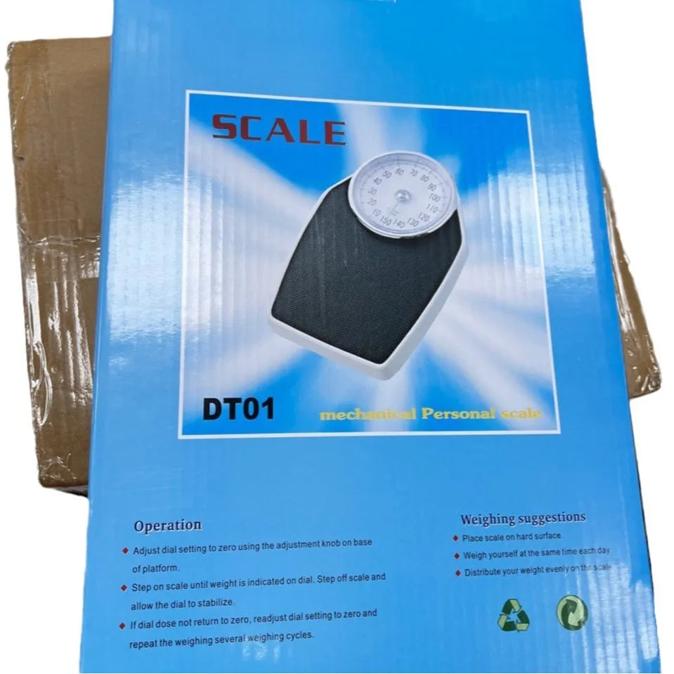 Black mechanical bathroom scale with large analogue dial display on white background