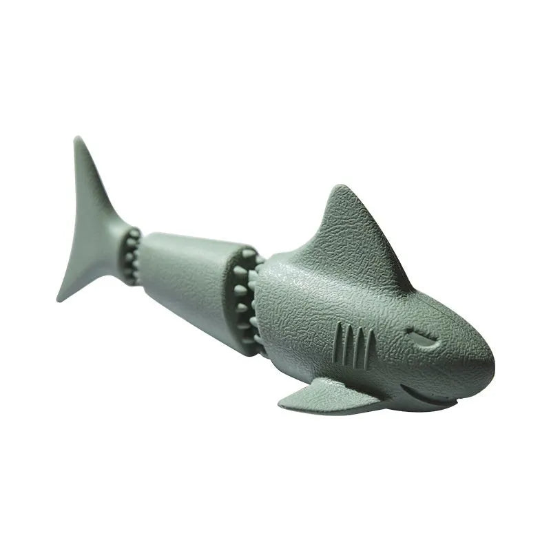Deep sea shark shaped natural rubber dog chew toy in blue, next to conch and starfish shapes in green.