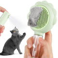 Grey self-cleaning cat brush with spray function and stainless steel bristles on a white background.
