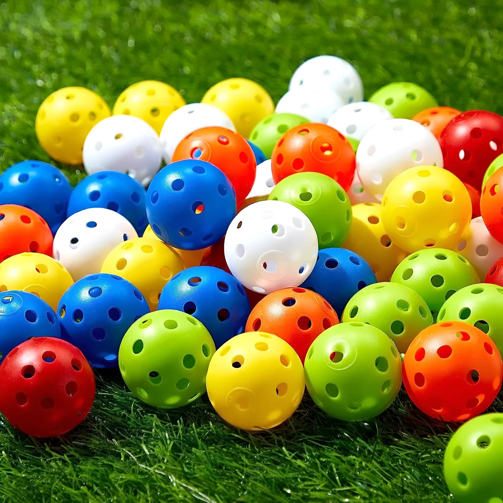 Multi-colour 42mm golf practice balls in red, blue, green, orange, white, and yellow in a net bag