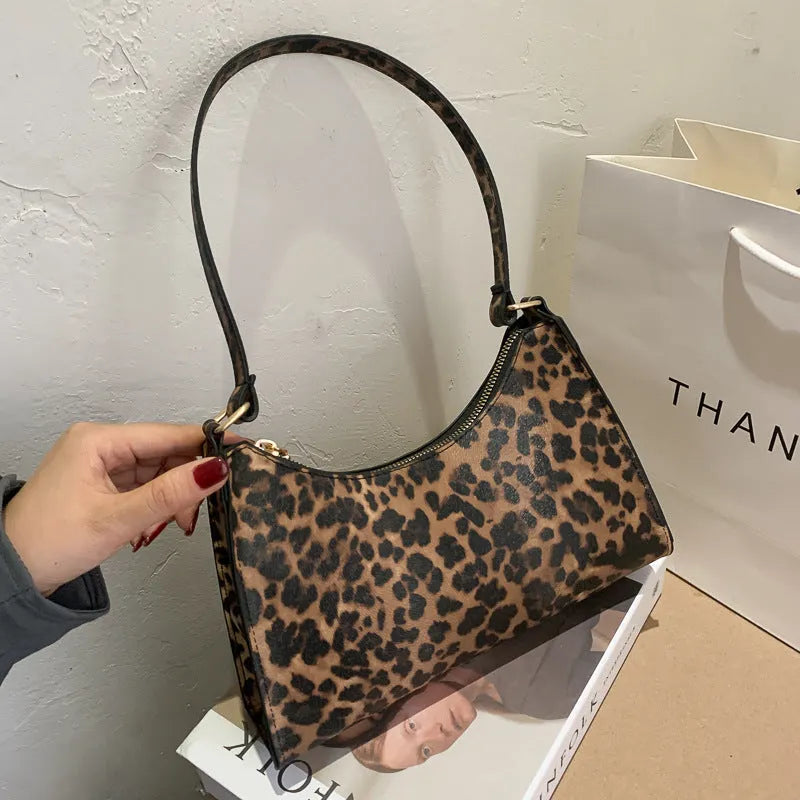 Small square PU leather underarm bag in a selection of colours and patterns including leopard print
