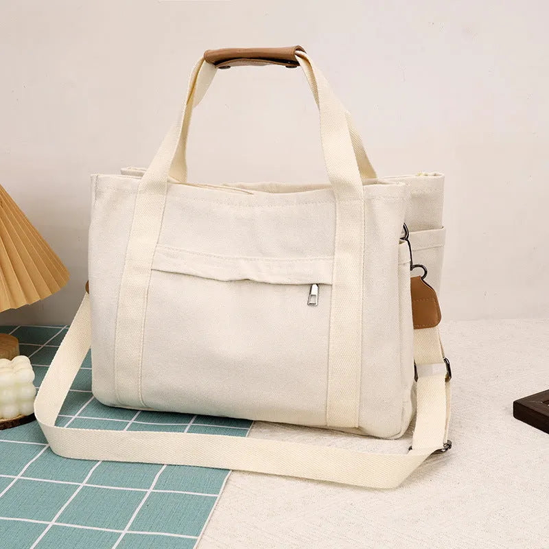 Large capacity canvas tote bag with internal organisers and side zippers in Army Green colour