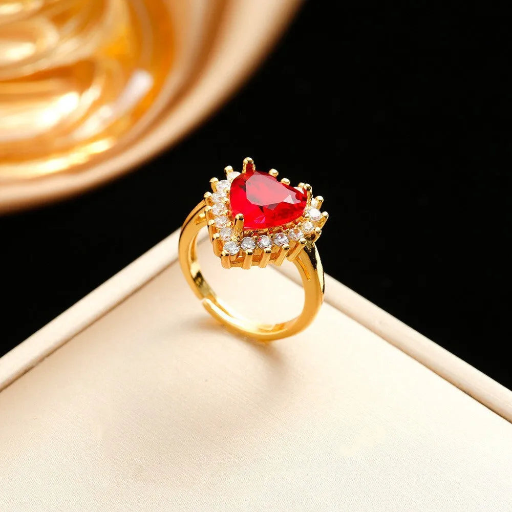 Gold-red titanium steel jewellery set with heart flower pendant necklace, stud earrings, and ring.