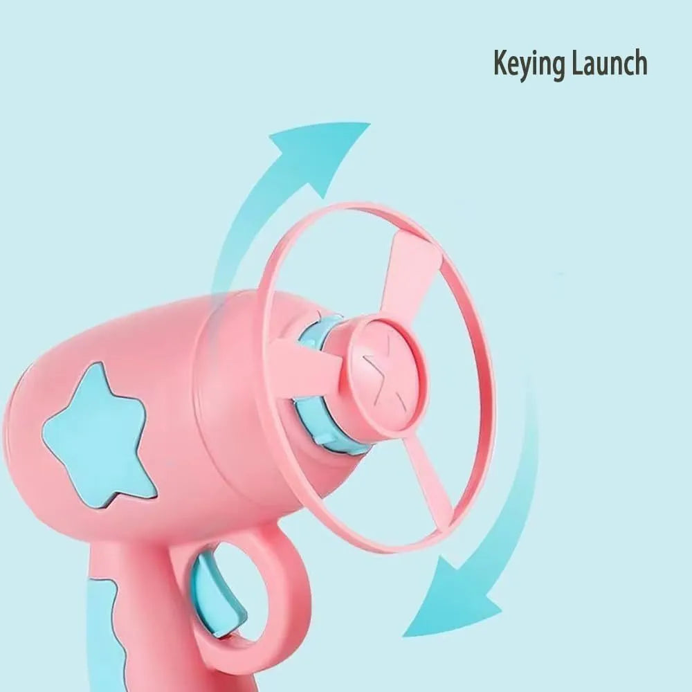 Blue plastic cat toy gun launcher with a mounted orange Frisbee, shown next to a second green Frisbee.