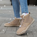 Waterproof fleece-lined snow boots with a round toe and front lace-up on a rubber sole.