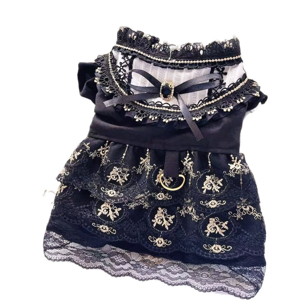Golden polyester gothic princess style dress for a small dog on a mannequin.