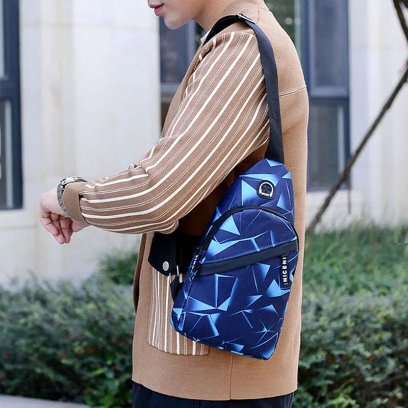 Blue Oxford cloth crossbody sling bag with earphone hole and zipper pocket.