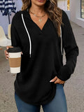 Red women's v-neck hooded sweatshirt with long sleeves on a hanger, loose fit.