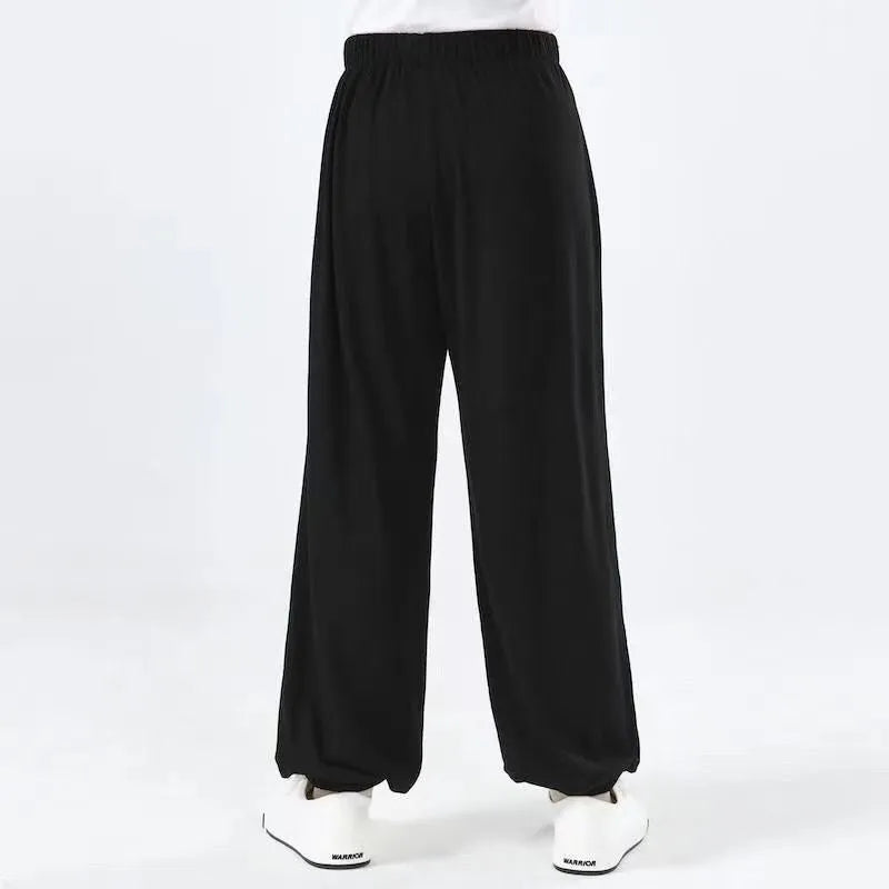 Children's black high-elasticity Lycra practice pants for Sanda martial arts training.