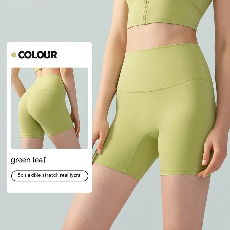 Women's lycra yoga tight shorts in leaf green colour showing high waist and short length design