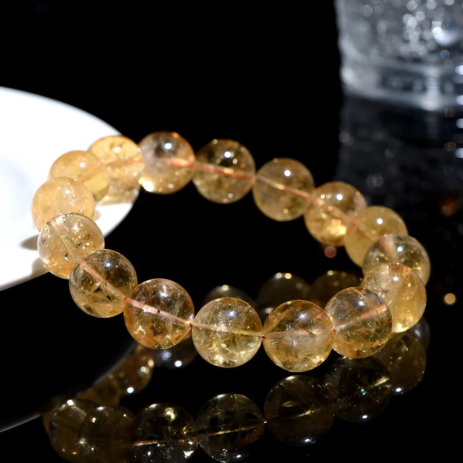 Natural yellow Asestelle citrine bracelet with hand-ground geometry beads on a wrist.
