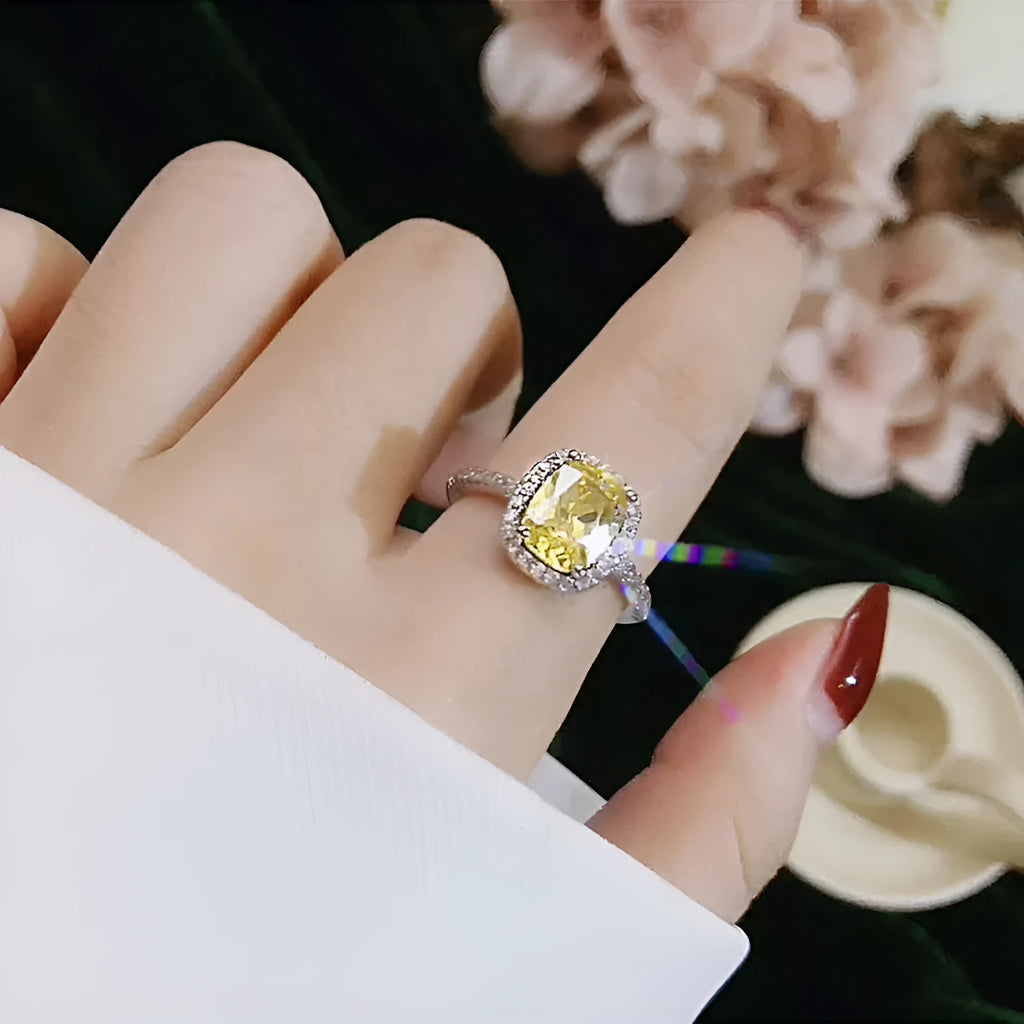 Silver alloy ring with artificial gemstone geometric inlay on white background