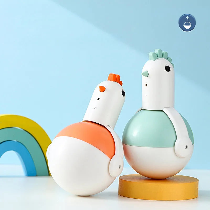 Green or orange electric cat toy chicken with laser and sound features on flat surface