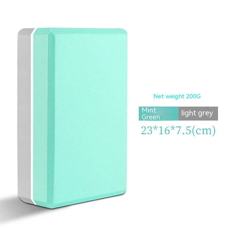 High-density EVA foam yoga block in various colours and prints on a workout mat.
