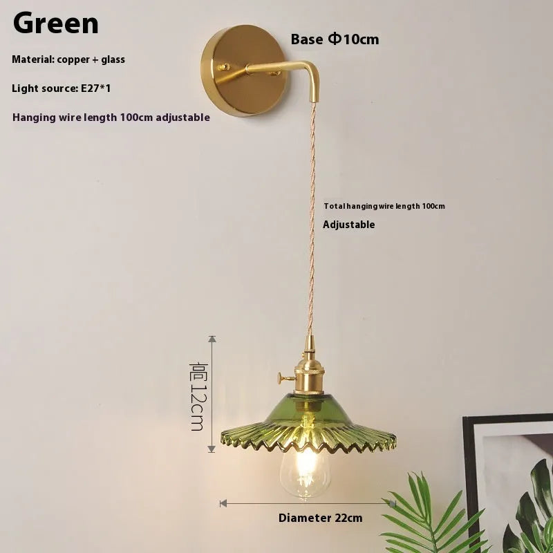 Retro copper lotus wall lamp with glass shade in choice of six colours, suspended from a wall