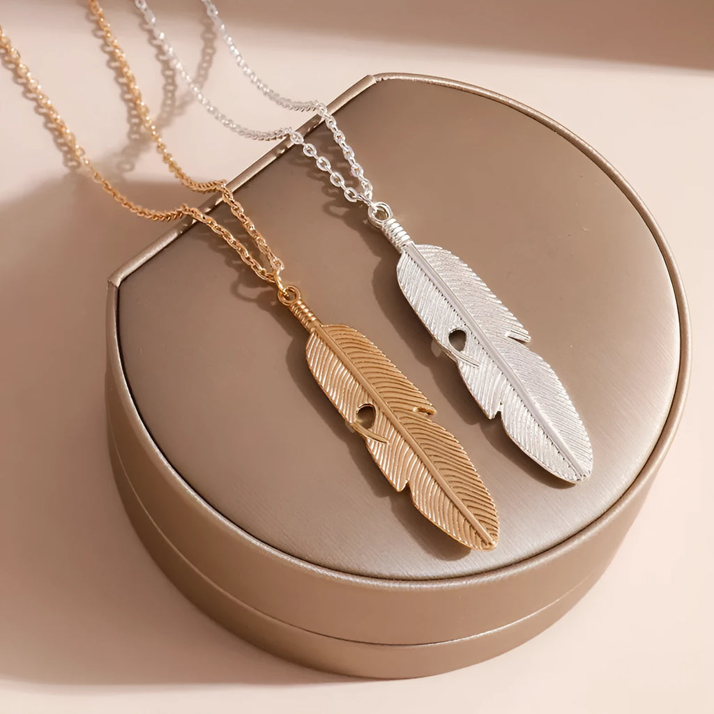 Retro feather tassel necklace for women in gold with geometric leaf pendant and feather tassel on alloy chain