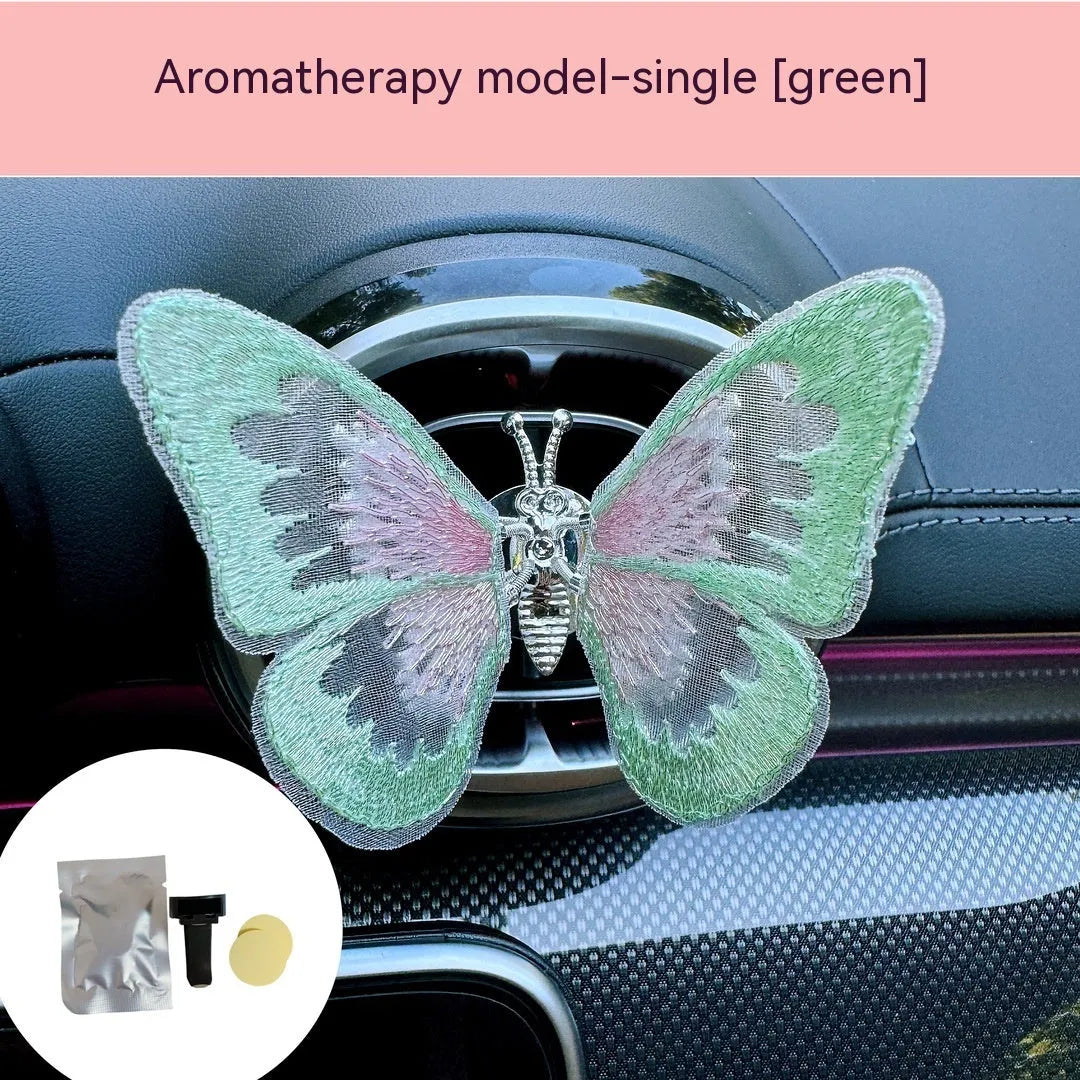 Moving embroidery butterfly decoration on car centre console air vent in pink fabric