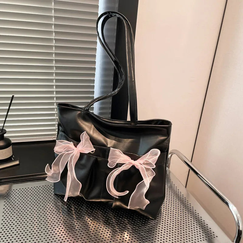 College style bow tote bag in black or pink with large capacity and internal zipper compartment