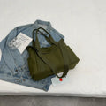 Polyester shoulder bag in solid colour with sandwich pocket and phone compartment
