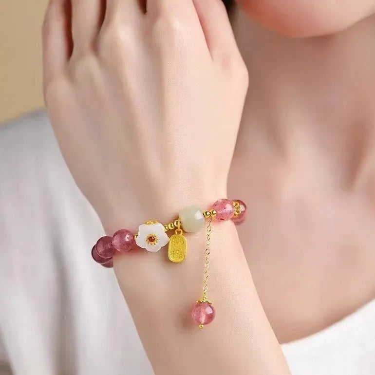 Handcrafted strawberry quartz crystal bracelet with Hetian jade peach blossom charms for women