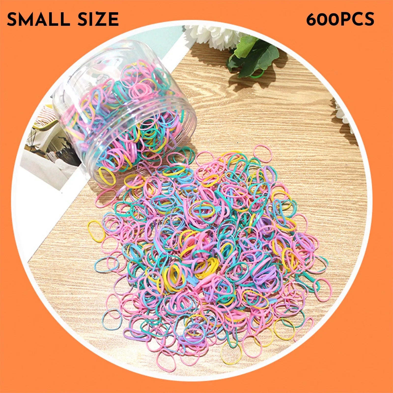 Open reusable container showing hundreds of thin, colourful TPU baby hair ties for toddlers.