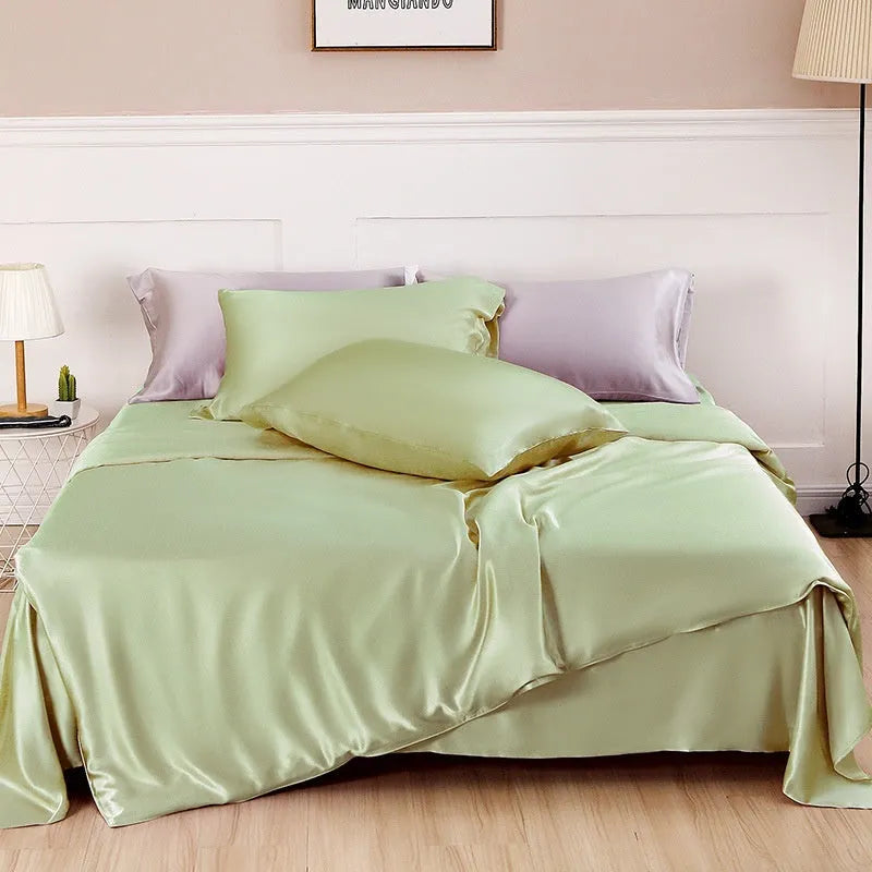 Reversible solid colour silk duvet cover shown in lotus pink, double-sided design.