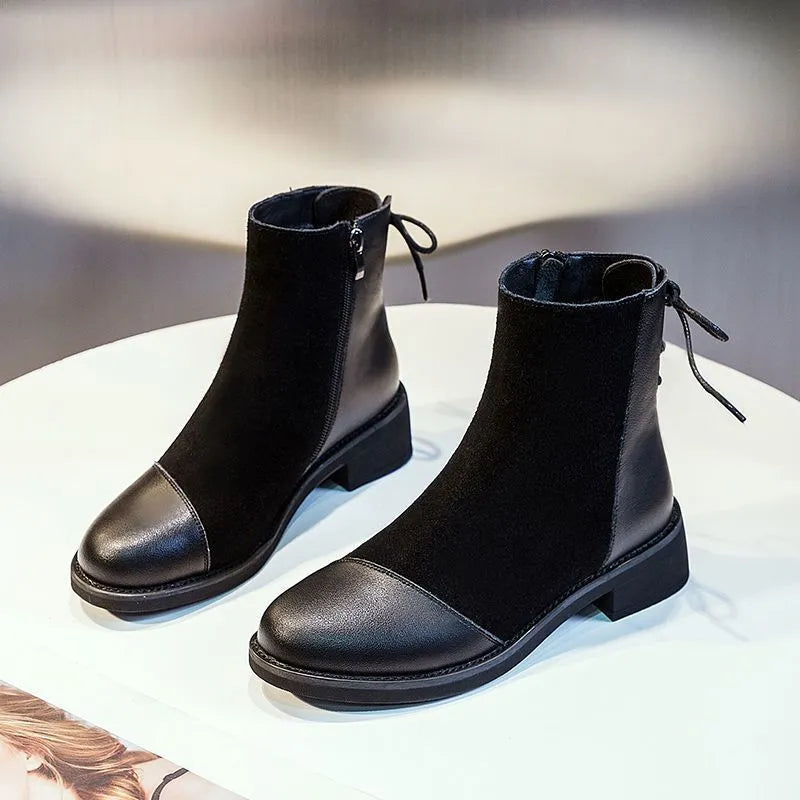 Women's black knee-high soft leather martin boots with side zipper and bow detail