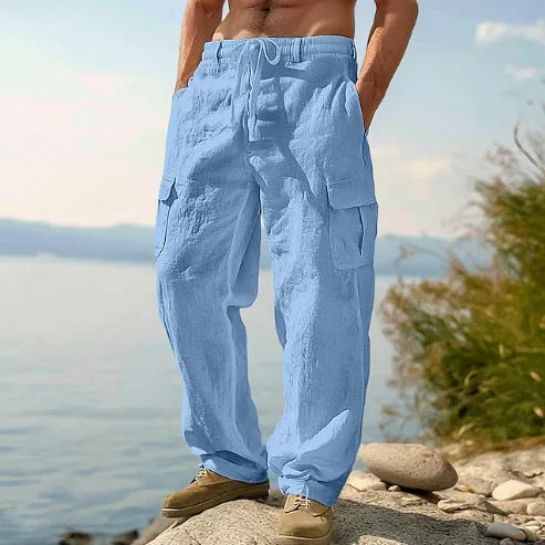 Men's loose cotton wide-leg casual trousers in light army green colour on a hanger.