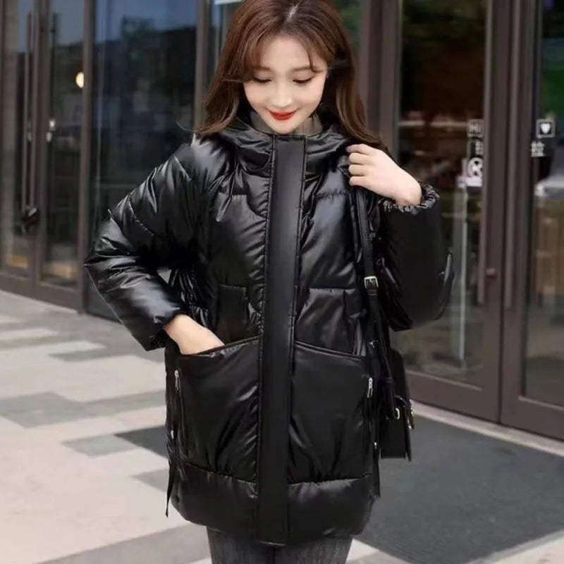 Women's loose thick winter hooded jacket in black colour with long sleeves