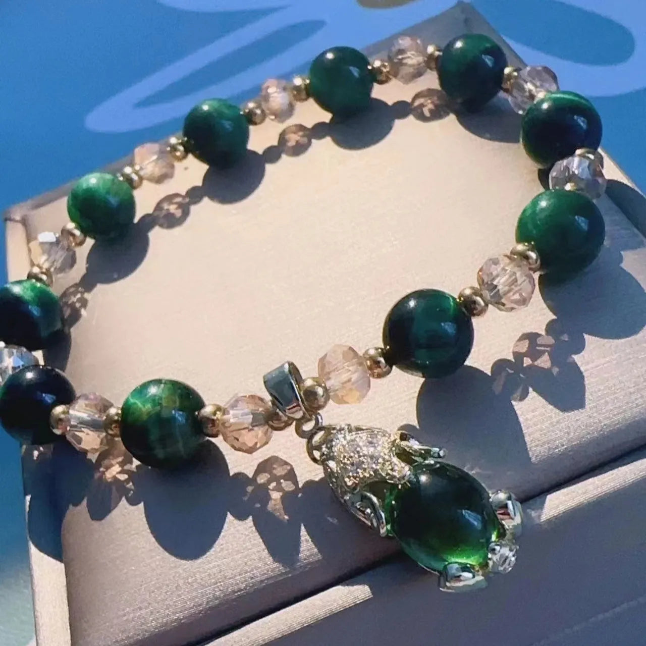 Handmade Tigereye crystal bracelet on a single chain and double chain in green and rose red styles.